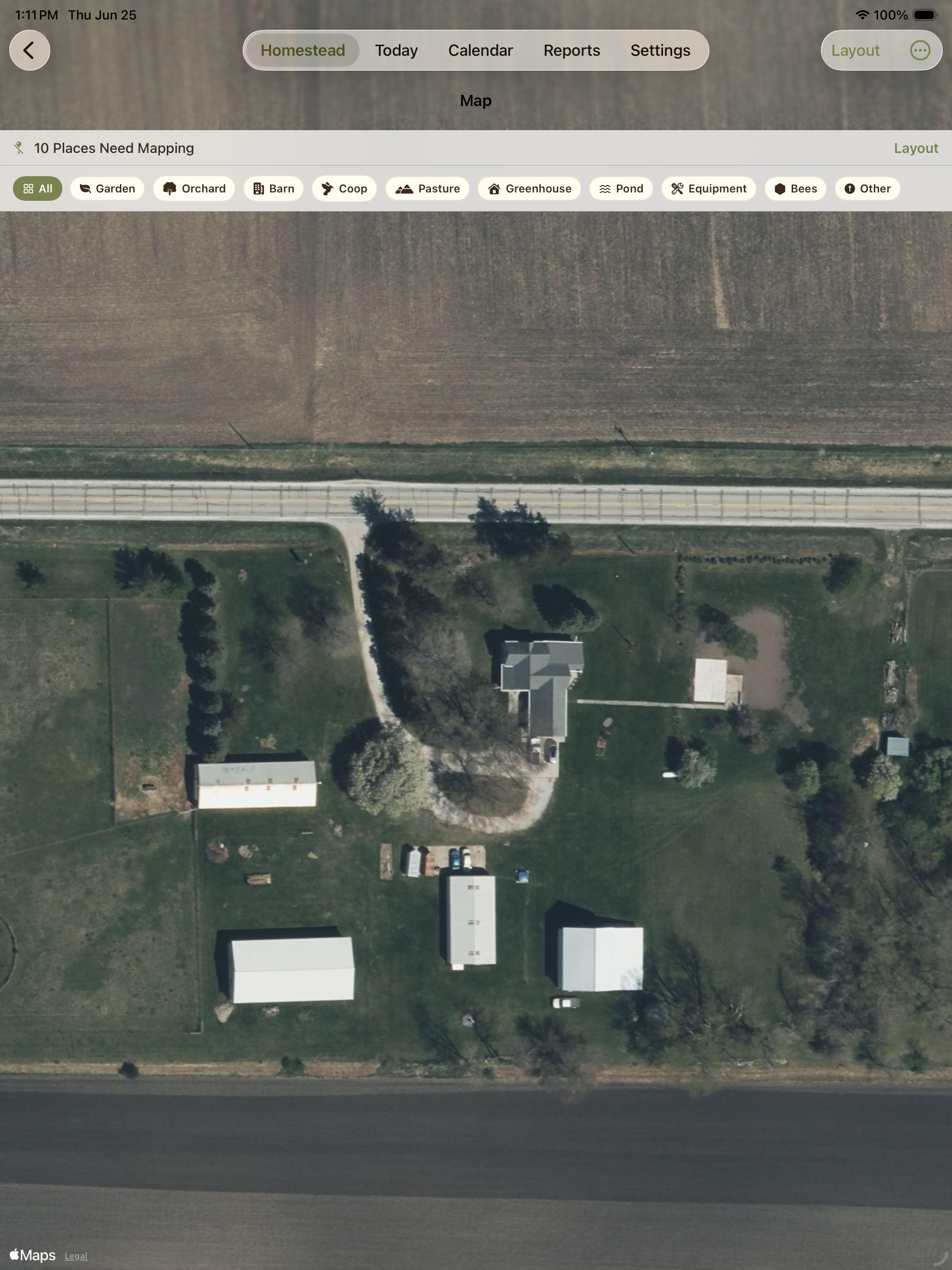 Satellite map showing barns, fields, driveway, and property structures.